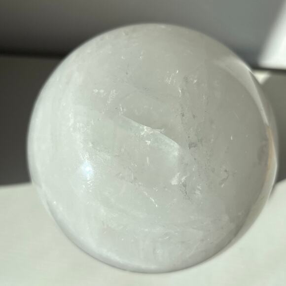 Large Milky Clear Quartz Sphere | Crystal Ball with Wispy Striped Inclusions - Picture 4 of 9